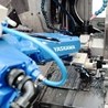 Robotic automation of a counter-spindle lathe